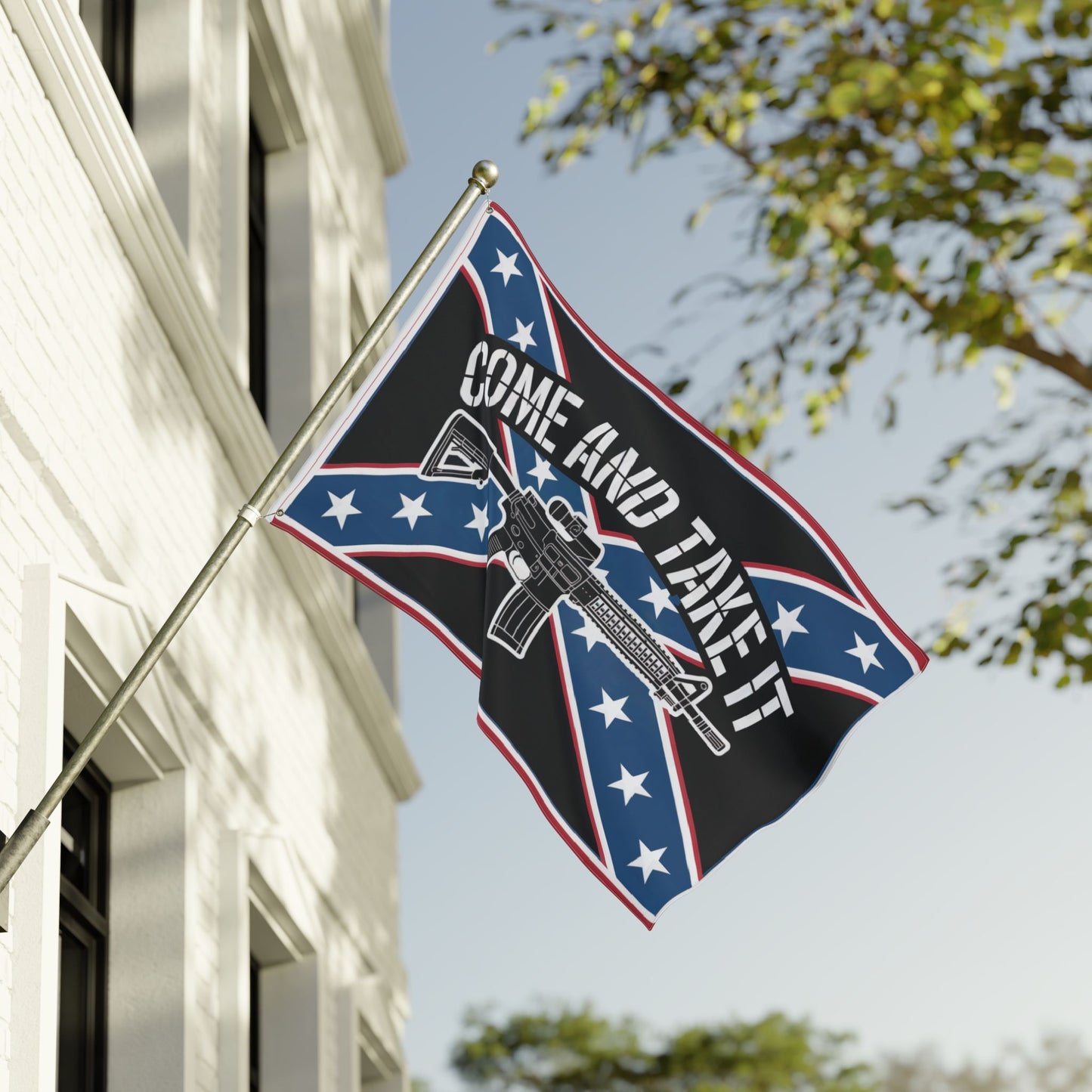 Come and Take It Confederate flag with rifle design flying on a pole outside a white building
