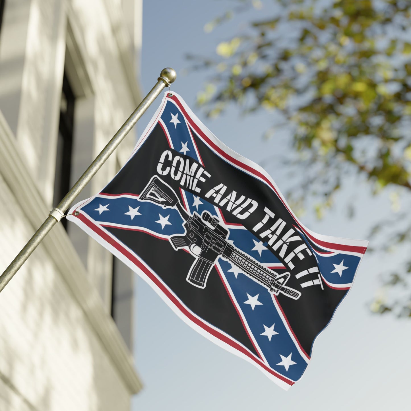 Come and Take It Confederate flag with firearm graphic flying on flagpole outdoors