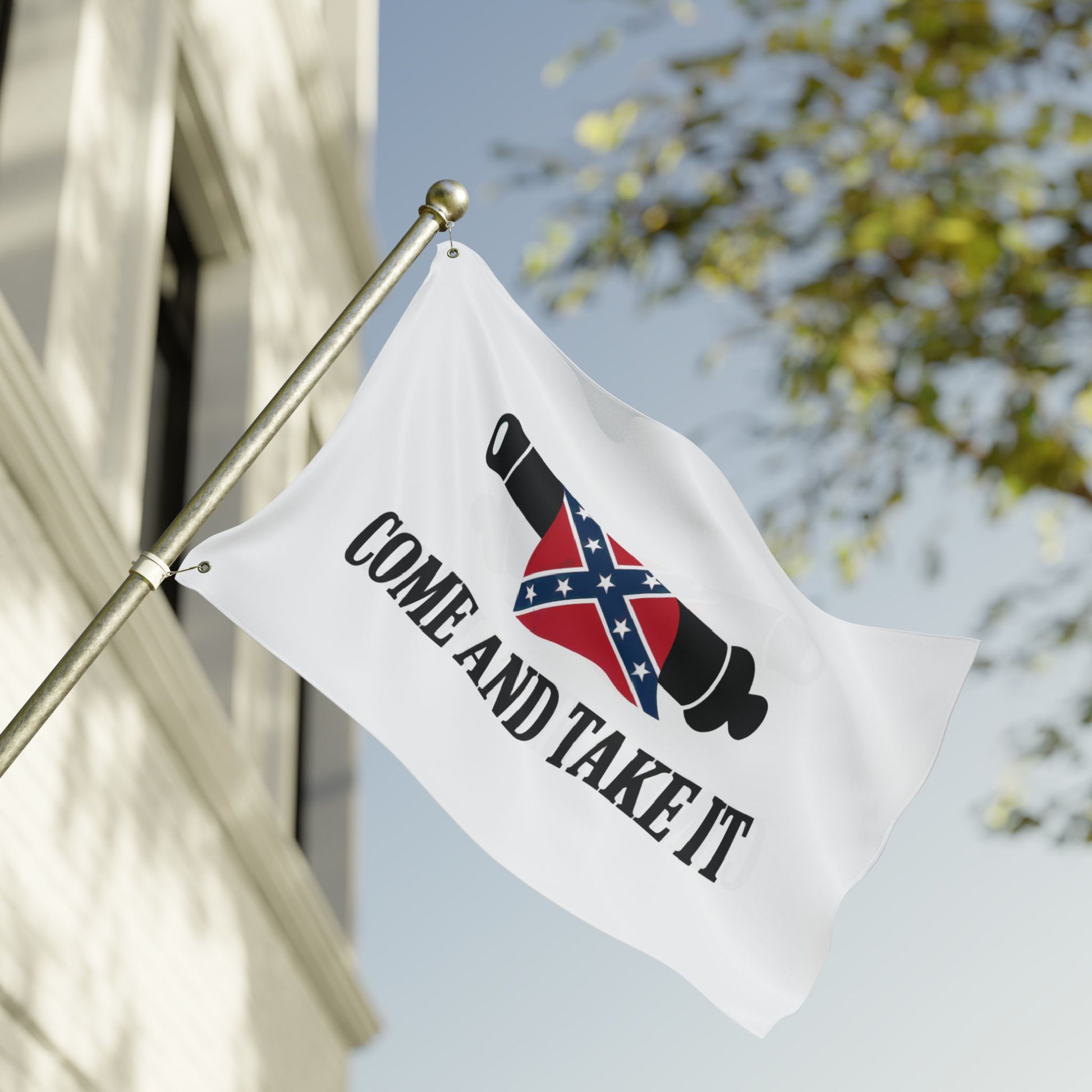Confederate Come and Take It flag with cannon and Confederate emblem waving outdoors