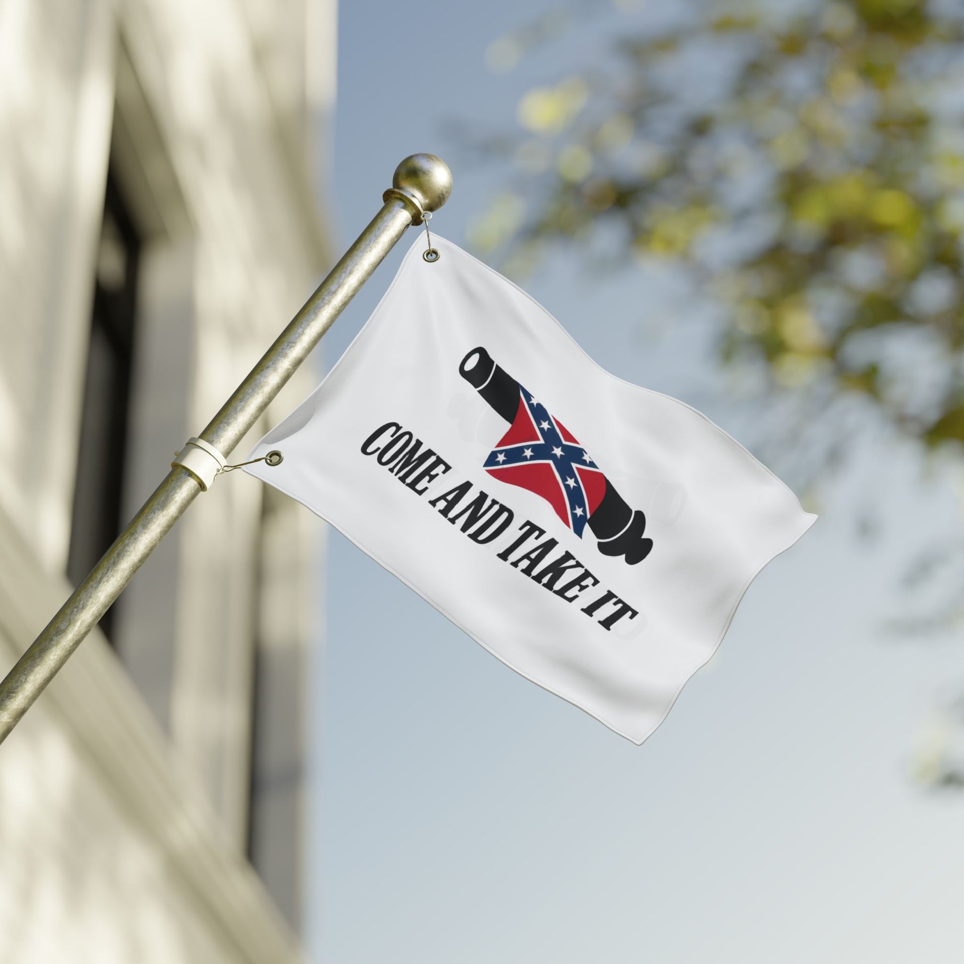 Confederate Come and Take It flag with cannon and text displayed on white fabric flying on flagpole