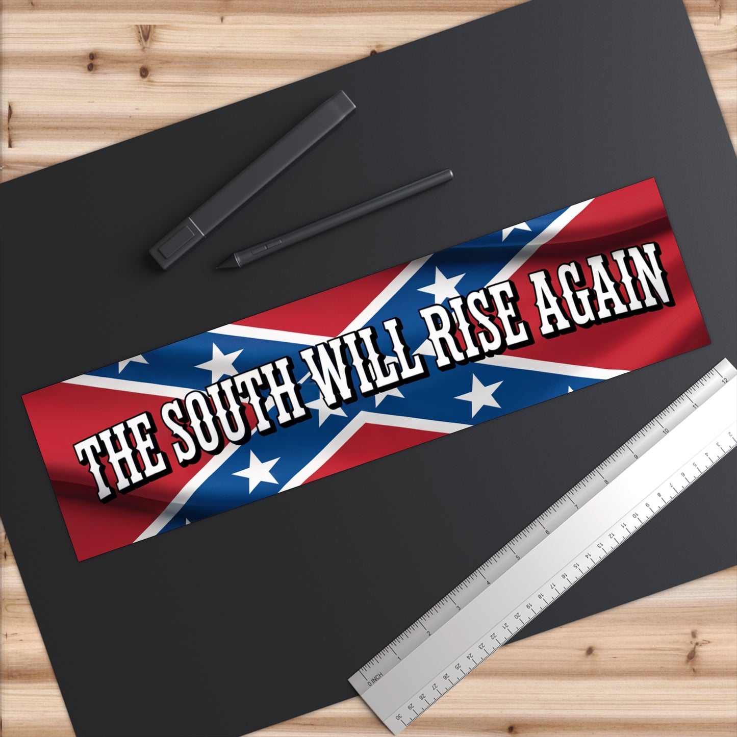 Confederate flag bumper sticker with the text The South Will Rise Again on a red and blue background