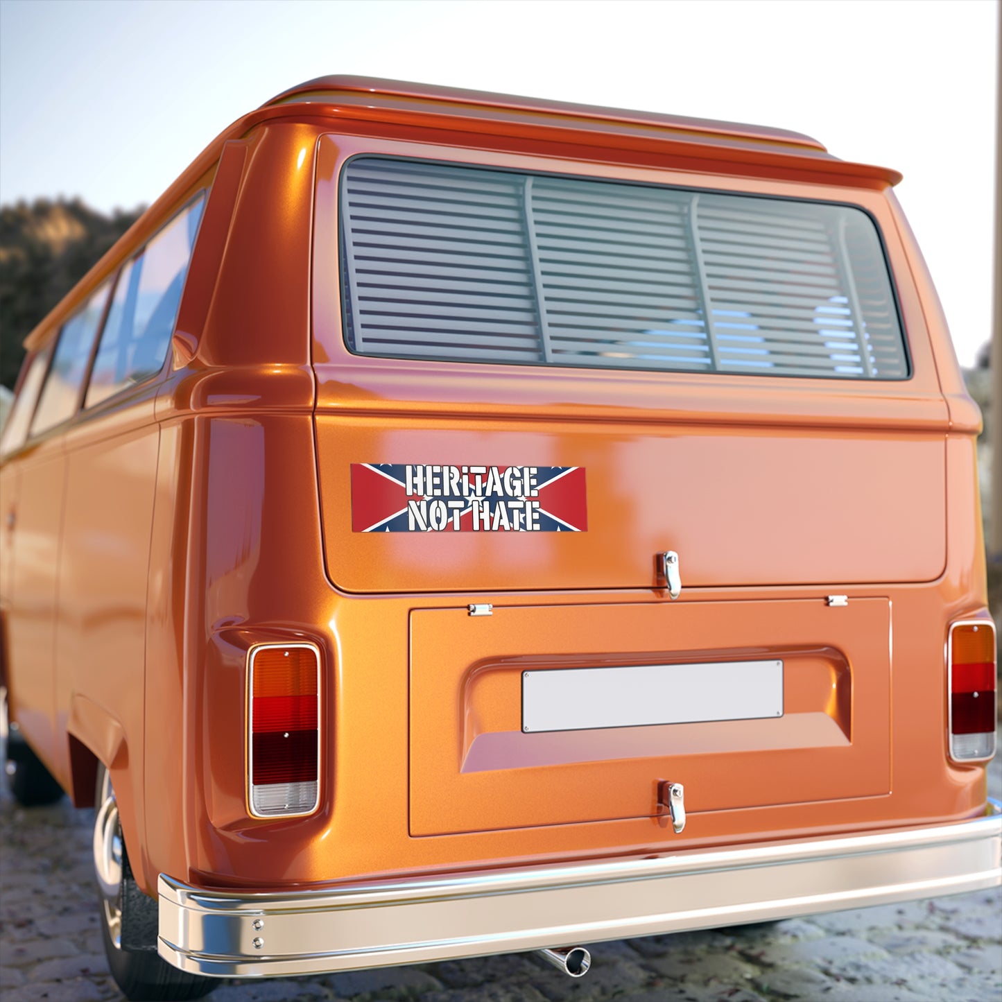 Orange vintage van with a heritage not hate bumper sticker on the rear door 
