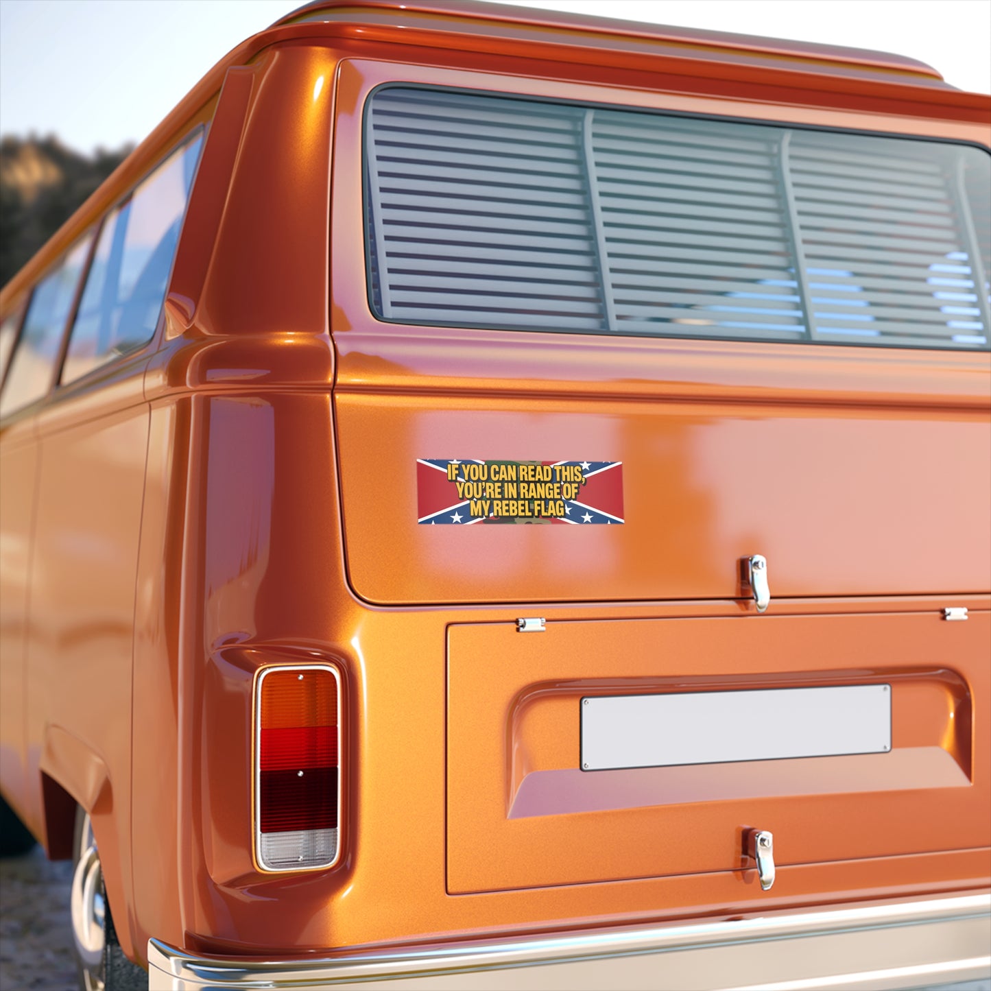 Orange vintage van with rebel flag bumper sticker on the rear displaying a bold message